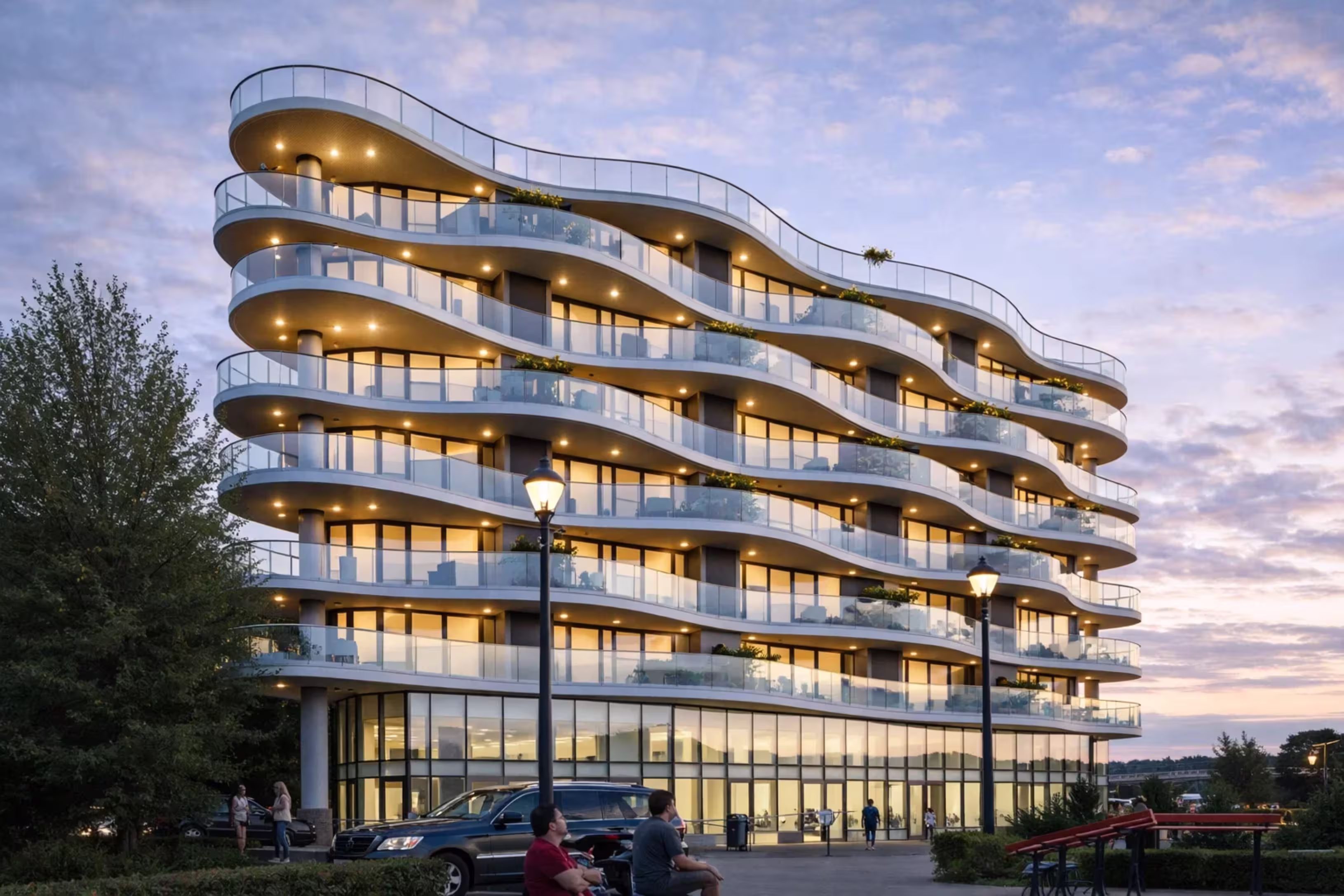 Lomora — curved-balcony residential tower at sunset